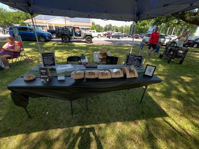 Market booth with loaves and chalkboard